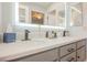 Bathroom vanity includes double sinks, white counters, and black hardware at 3213 Oyster Bay St, Las Vegas, NV 89117