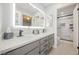 Bathroom vanity boasts double sinks, a lighted mirror, and access to the shower at 3213 Oyster Bay St, Las Vegas, NV 89117