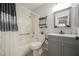 Updated bathroom featuring a shower-tub combo, modern vanity, and stylish black fixtures at 3213 Oyster Bay St, Las Vegas, NV 89117