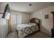 Comfortable bedroom with a plush bed, neutral walls and window with natural light at 3213 Oyster Bay St, Las Vegas, NV 89117