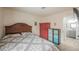 Inviting bedroom featuring a cozy bed, modern storage units, and an open en-suite bathroom at 3213 Oyster Bay St, Las Vegas, NV 89117