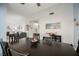 Elegant dining room with a dark wood table, comfortable seating, and stylish decor at 3213 Oyster Bay St, Las Vegas, NV 89117
