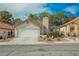 Charming single-story home features a two-car garage, tile roof, and well-maintained landscaping at 3213 Oyster Bay St, Las Vegas, NV 89117