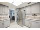 Bright kitchen features stainless steel appliances, ample gray cabinetry, and stone countertops at 3213 Oyster Bay St, Las Vegas, NV 89117