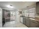 Bright kitchen featuring granite countertops, stainless steel sink and access to the backyard at 3213 Oyster Bay St, Las Vegas, NV 89117