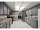 Spacious kitchen boasts stainless steel appliances, granite countertops, and ample cabinetry at 3213 Oyster Bay St, Las Vegas, NV 89117