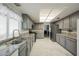 Updated kitchen features granite countertops, stainless steel appliances, and tile flooring at 3213 Oyster Bay St, Las Vegas, NV 89117