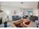 Bright and inviting living room featuring ample seating and an eye-catching rug at 3213 Oyster Bay St, Las Vegas, NV 89117
