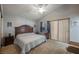 Comfortable main bedroom with a ceiling fan, neutral carpet, and a sliding glass door at 3213 Oyster Bay St, Las Vegas, NV 89117