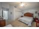 Main bedroom offers vaulted ceilings, neutral carpet, and closet with sliding doors at 3213 Oyster Bay St, Las Vegas, NV 89117