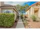 Exterior shot of walkway, metal gate, and meticulous landscaping in side yard at 3213 Oyster Bay St, Las Vegas, NV 89117