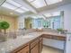 Bright bathroom featuring granite counters, cabinets, ample counter space, and an oversized mirror at 3251 Southridge Ave, Las Vegas, NV 89121