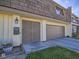 A close-up of the townhome's front entrance, highlighting the unique front door, mailbox, and one car garage at 3251 Southridge Ave, Las Vegas, NV 89121