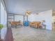 Bright living room featuring an accent wall, neutral furnishings, tile flooring and a ceiling fan at 3251 Southridge Ave, Las Vegas, NV 89121