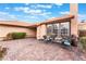 Paver patio with seating and lush greenery, offering a relaxing and inviting outdoor space at 3901 W Red Coach Ave, North Las Vegas, NV 89031