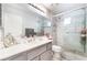 Modern bathroom featuring a glass shower, a large mirror and plenty of counter space at 3901 W Red Coach Ave, North Las Vegas, NV 89031