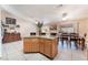 Open dining area with tile floors and an island at 3901 W Red Coach Ave, North Las Vegas, NV 89031