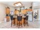 Kitchen featuring granite counters, island with seating, and ample cabinet space at 3901 W Red Coach Ave, North Las Vegas, NV 89031