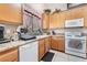 Bright kitchen features light-colored cabinets, granite countertops, and modern appliances at 3901 W Red Coach Ave, North Las Vegas, NV 89031