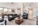 Spacious living room with neutral walls, plush sofas, decorative accents, and ample natural light at 3901 W Red Coach Ave, North Las Vegas, NV 89031