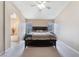 Spacious main bedroom boasts a king-sized bed, plush carpeting, and ample natural light at 3901 W Red Coach Ave, North Las Vegas, NV 89031