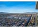 Expansive aerial view showcases the surrounding Las Vegas community and mountain views at 4381 W Flamingo Rd # 3303, Las Vegas, NV 89103