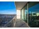 Balcony with glass railings offering panoramic views of the city skyline at 4381 W Flamingo Rd # 3303, Las Vegas, NV 89103