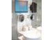 Bathroom featuring double sinks, lighted mirrors, and a television at 4381 W Flamingo Rd # 3303, Las Vegas, NV 89103