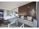 Comfortable room with bedroom area, sofa seating and large glass window for separation at 4381 W Flamingo Rd # 3303, Las Vegas, NV 89103