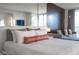 Bright bedroom with a large king bed, sitting area, and mirrored walls for added spaciousness at 4381 W Flamingo Rd # 3303, Las Vegas, NV 89103