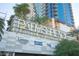 Signage for 'Palms Place' atop a modern, luxury high-rise building with greenery at 4381 W Flamingo Rd # 3303, Las Vegas, NV 89103
