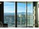 Expansive city view from floor-to-ceiling windows with a balcony overlooking the mountains at 4381 W Flamingo Rd # 3303, Las Vegas, NV 89103