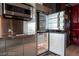 Well-equipped kitchen featuring stainless steel appliances, a built-in microwave, and a refrigerator at 4381 W Flamingo Rd # 3303, Las Vegas, NV 89103
