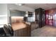 Modern kitchenette features stainless steel appliances, breakfast bar, and sleek design at 4381 W Flamingo Rd # 3303, Las Vegas, NV 89103