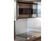 A well-lit stainless steel microwave sits above a smooth cooktop at 4381 W Flamingo Rd # 3303, Las Vegas, NV 89103