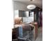 Kitchenette features stainless steel appliances, a breakfast bar, and a modern lighting fixture at 4381 W Flamingo Rd # 3303, Las Vegas, NV 89103