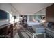 Open living area with a comfortable lounge, mirrored wall, and seamless flow to dining at 4381 W Flamingo Rd # 3303, Las Vegas, NV 89103