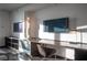 Bright office area featuring a sleek desk, modern chair, and two flat-screen TVs for work and entertainment at 4381 W Flamingo Rd # 3303, Las Vegas, NV 89103