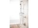 Modern shower featuring a handheld shower wand, and sleek, white marble-look tiling at 4381 W Flamingo Rd # 3303, Las Vegas, NV 89103