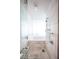 Sleek tiled shower with built-in bench and modern fixtures at 4381 W Flamingo Rd # 3303, Las Vegas, NV 89103