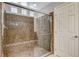 Elegant glass enclosed shower with a built-in bench at 5309 Tartan Hill Ave, Las Vegas, NV 89141