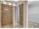 Bathroom shower with glass door next to a walk-in closet at 5309 Tartan Hill Ave, Las Vegas, NV 89141