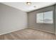 Bedroom featuring plush carpeting, neutral walls, and a window with blinds at 5309 Tartan Hill Ave, Las Vegas, NV 89141