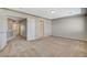 Spacious bedroom has neutral carpet and leads to a hallway at 5309 Tartan Hill Ave, Las Vegas, NV 89141