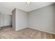 Bedroom featuring plush carpeting, neutral walls, and an open hallway at 5309 Tartan Hill Ave, Las Vegas, NV 89141