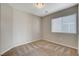 Bedroom features plush carpeting and a window with blinds for natural light at 5309 Tartan Hill Ave, Las Vegas, NV 89141