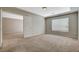 Bedroom with tray ceiling and a doorway leading to another room at 5309 Tartan Hill Ave, Las Vegas, NV 89141