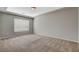 Bright bedroom featuring neutral walls, carpet, and a window at 5309 Tartan Hill Ave, Las Vegas, NV 89141