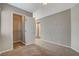 Bedroom view showcasing closet with an opened door and neutral colored walls at 5309 Tartan Hill Ave, Las Vegas, NV 89141