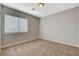 Bedroom features plush carpeting and a window with blinds for natural light at 5309 Tartan Hill Ave, Las Vegas, NV 89141